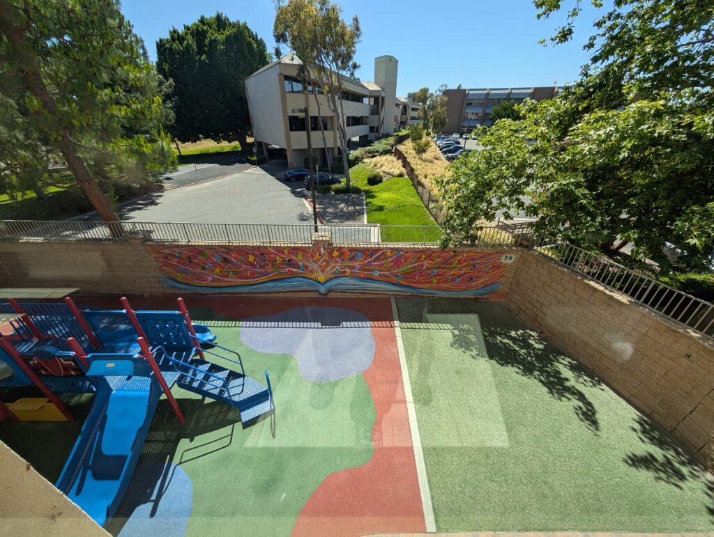 Learning Comes Alive mural by Yitzchok Moully at Chabad of Irvine for the Jewish Street Art Festival